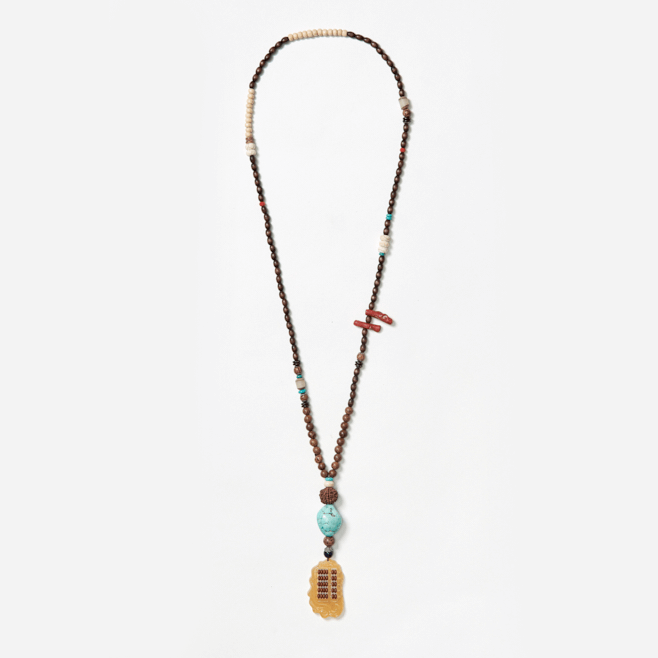 beaded neckpiece with ethnic abacus pendant