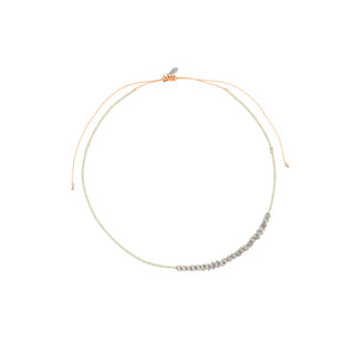 Delicate silver-tone necklace featuring faceted light grey beads, finished with an adjustable sliding clasp for a clean, contemporary look.