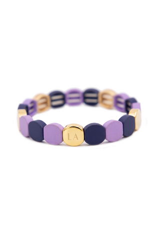 Chevron-inspired Purple Reign Bracelet featuring alternating violet and deep navy resin links with a polished gold accent.
