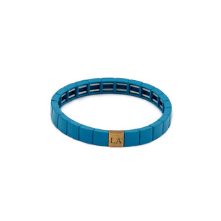 Vibrant turquoise resin bracelet featuring smooth geometric links and a polished gold Leigh Avenue accent, designed for effortless everyday style.