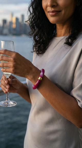 Styled for sunset gatherings, this marbled berry resin bracelet adds a sophisticated splash of colour to an elegant women's wardrobe.