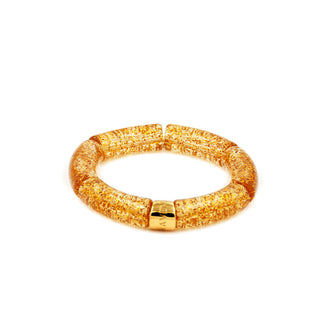 Glittering gold resin bracelet with shimmering rounded links and a polished gold Leigh Avenue accent, designed to catch the light with every movement.