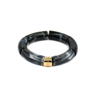 Glittering gold resin bracelet with shimmering rounded links and a polished gold Leigh Avenue accent, designed to catch the light with every movement.