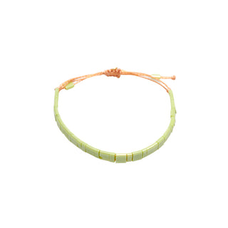 Adjustable light green tile beaded bracelet with a minimalist design, featuring smooth pastel green beads and a sliding cord closure for a clean, modern everyday style.
