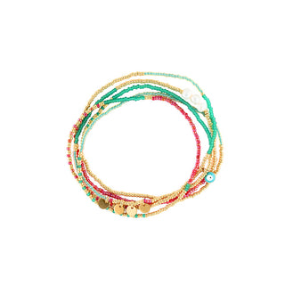 Multi-strand beaded necklace featuring turquoise, aqua, coral pink, white, and polished gold beads with natural shell accents, gold disc charms, and an evil eye detail for a vibrant layered look.