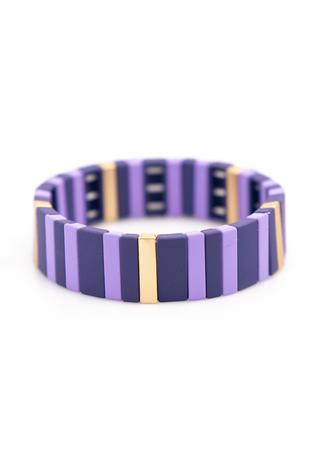 Purple Reign Bracelet showcasing alternating violet resin tiles with polished gold accents, creating a contemporary geometric design.