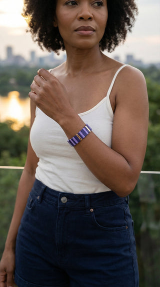 A lady wearing the Purple Reign Bracelet, where layered shades of violet and gold bring a refined touch to effortless everyday style.